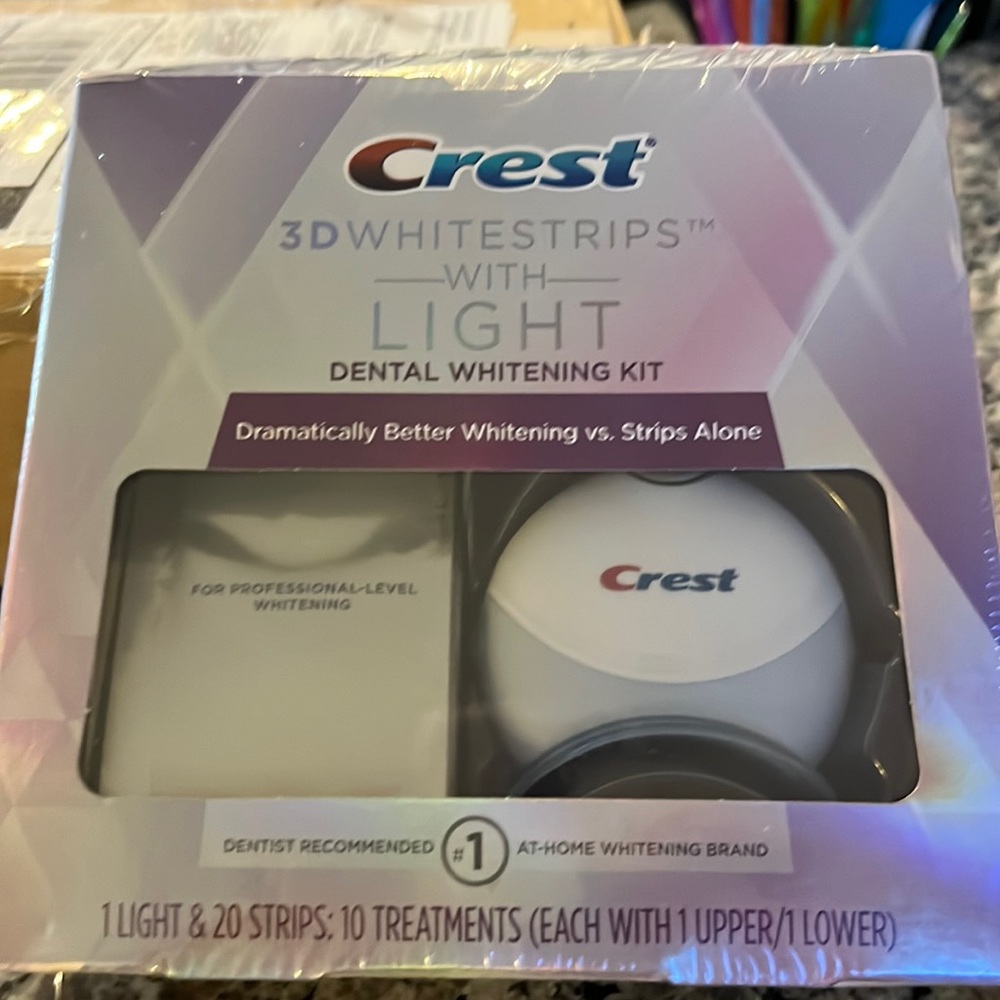 NWT still in packaging wrap- crest 3D white strips with light.